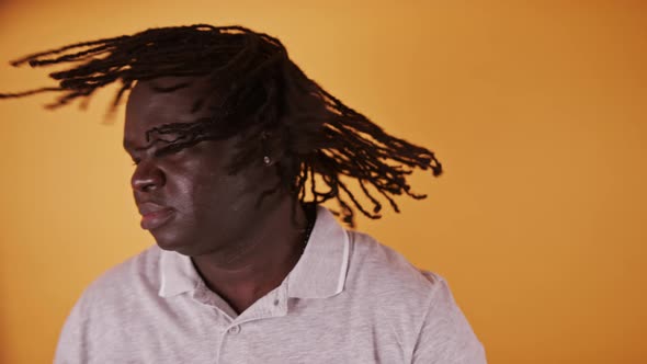 Portrait of Young African American Black Man Shaking His Head with Braided Hair