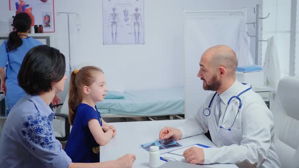 Radiologist Having Good News for Child