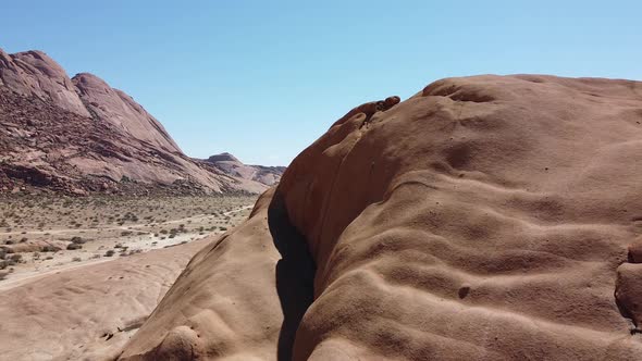 Drone footage of the rocky mountains and view on the desert, Erongo, Namibia