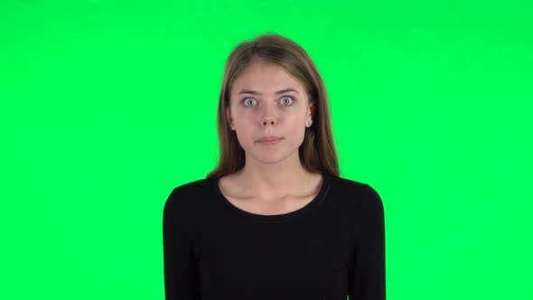 Displeased Woman Indignantly Talking To Someone, Looking at the Camera. Green Screen