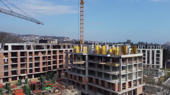 Busy Construction Site and Construction Equipment Aerial Top View