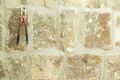 Old moldy stone wall with work scissors. - PhotoDune Item for Sale