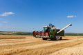 Combine harvester working on a wheat field. - PhotoDune Item for Sale