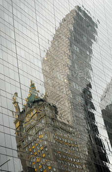 pers reflecting in office building in New York City, architectural background reflections.