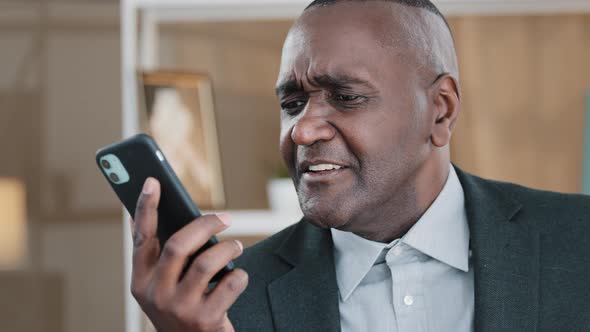 African Old Man Senior Mature Male Phone Problem Bad Hearing Confused 60s Biracial Businessman