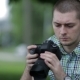 Young Man Taking Pictures At A Professional Digital Slr Camera - VideoHive Item for Sale