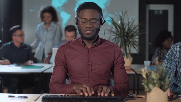 Cheerful Men Call Center Operator at Work