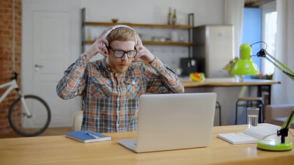 Young Man Being Fired During Video Conference on Laptop