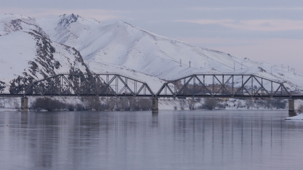 Railway Bridge Over the River By Snowy Mountains