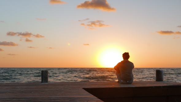 Closer Look at Man Watching the Sunset