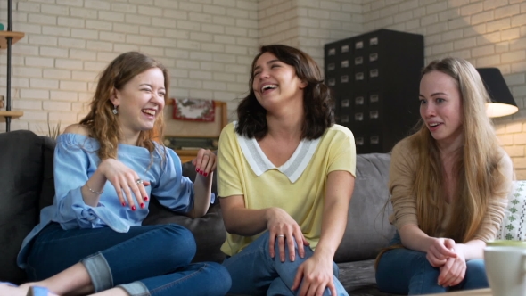 Three Best Female Friends Have Fun Sitting at Home