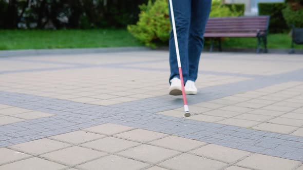 Blind Man Walking with a Cane at the Park