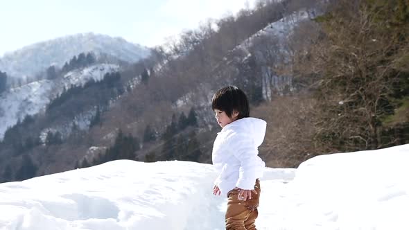 Cute Asian Child Playing Snow Outdoors Slow Motion