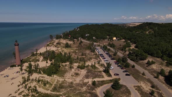 4k drone video of Little Sable Lighthouse in Silver Lake, Michigan in the summer.