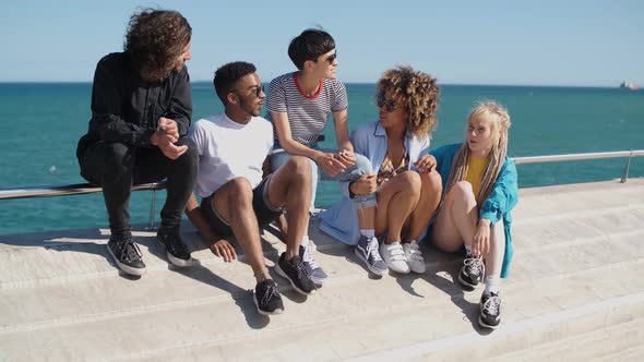 Stylish Young Friends on City Embankment