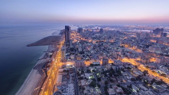 Cityscape of Ajman From Rooftop Night To Day