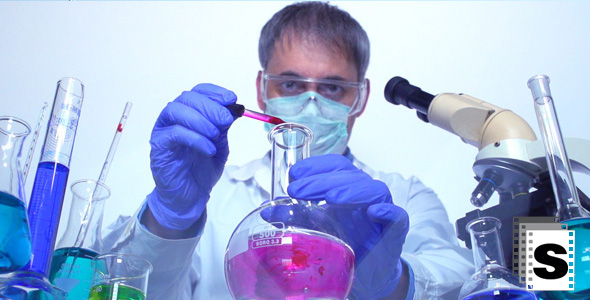 Chemist in the Lab Mixing Liquids
