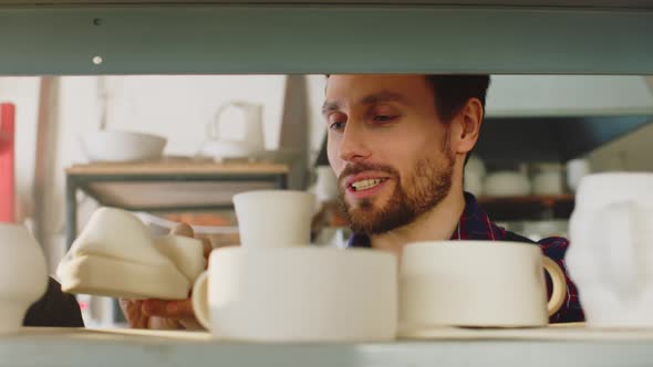 Couple Is Looking On Ceramic Items