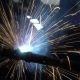 Welder Builds Up the Metal on the Workpiece. Sparks From Welding. Welding Mask - VideoHive Item for Sale