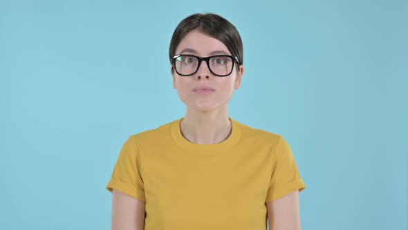 Curious Young Woman Feeling Shocked on Purple Background 