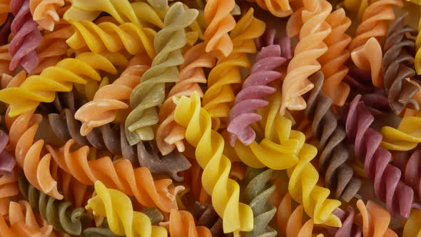 Colored italian fusilli raw pasta