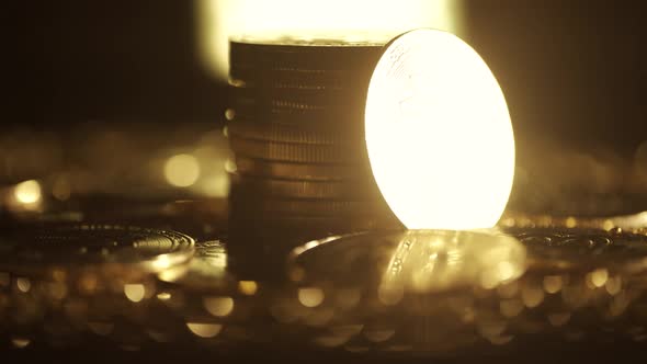 Golden Bitcoin Coins are Rotating on a Dark Background