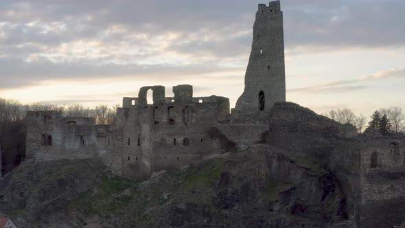 Ruins of medieval castle Okoř in Czechia against evening autumn sky.