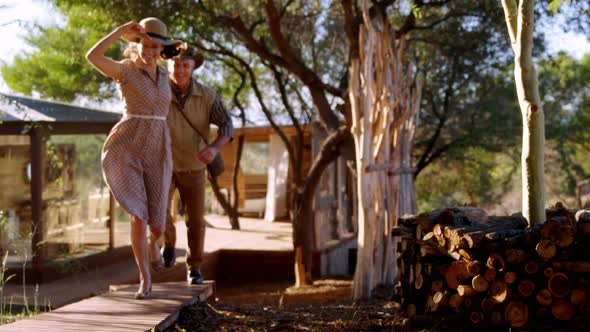 Senior couple running on wooden plank 4k