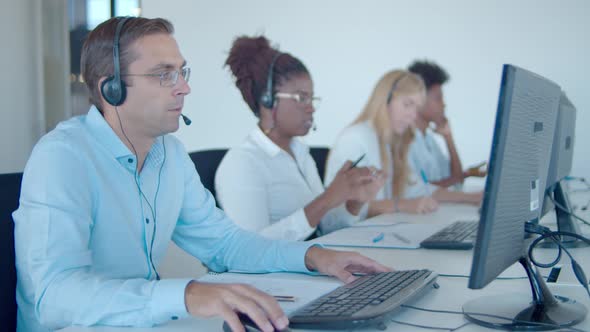 Team Call Center Consultants Headset Sitting Row