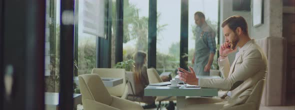 Man in suit having business call