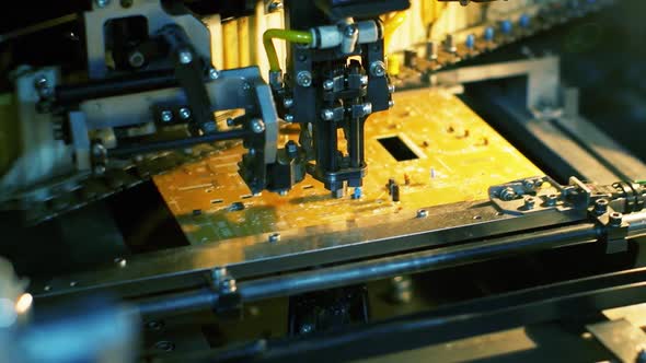 Factory Floor: Pick-and-Place Machine Assembling Components on PCB