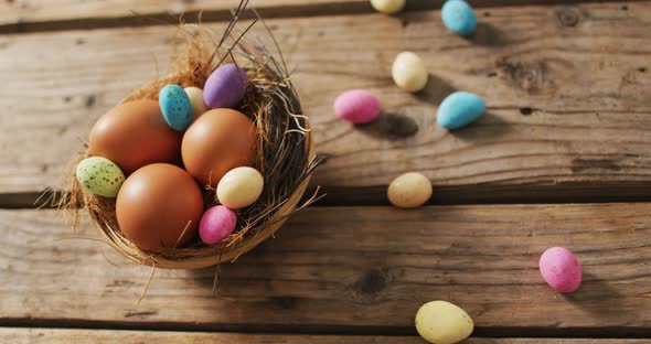 Video of eggs and chocolate eggs on a wooden surface