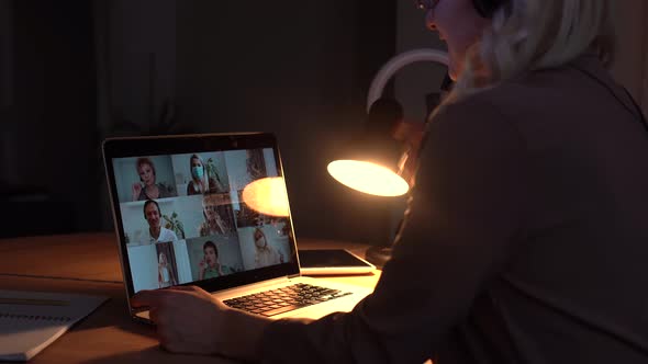 Woman Working From Home Having Group Videoconference On Laptop