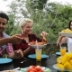 People Passing Food Eating On Terrace Young Friends Talking Sitting At Table Outdoors Communication - VideoHive Item for Sale