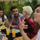 People Talking Sitting At Table Outdoors Eating On Terrace Young Friends Group Happy Smiling - VideoHive Item for Sale