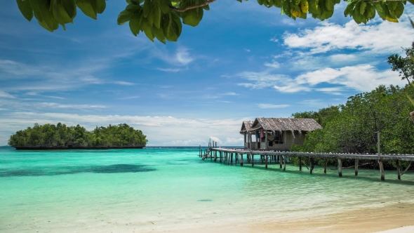 Blue Lagune with Calm Clear Water in Front of Bamboo Huts on Wooden Stocks of an Homestay, Gam