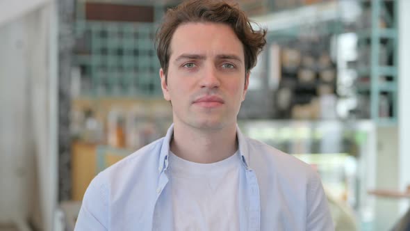 Portrait of Angry Young Man Shouting Screaming