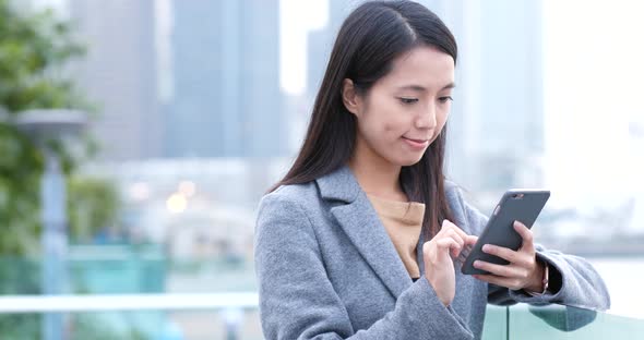 Woman use of mobile phone at night