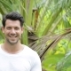 Young Man Smiling Outdoors Happy Handsome Guy  Over Green Trees In Tropical Forest - VideoHive Item for Sale