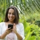Young Woman Using Cell Smart Phone Smiling Looking In Camera Outdoors Girl  Chatting Online Ove - VideoHive Item for Sale