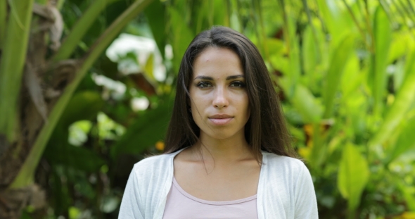 Young Woman Smiling Outdoors Happy Brunette Girl  Over Green Trees In Tropical Forest