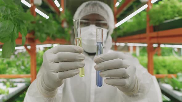 Agronomic Researcher Holding Test Tubes