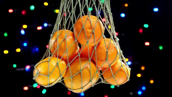 Green Mesh Bag with Christmas Orange Tangerine Fruits