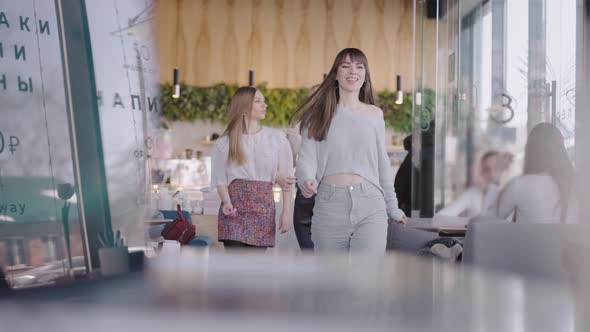 Three Beautiful Young Women Came to a Meeting in a Cafe