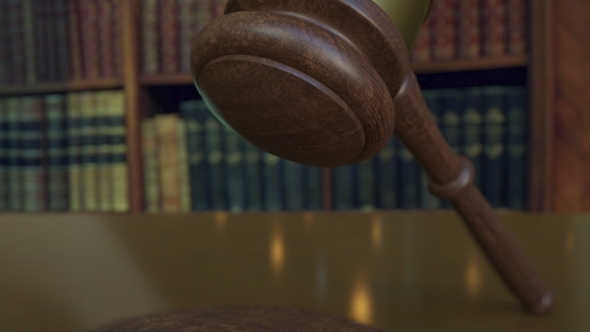 Judge's Gavel Falling and Hitting the Block with CLAIM Inscription alt