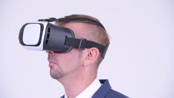 Head Shot of Blonde Businessman Using Virtual Reality Headset