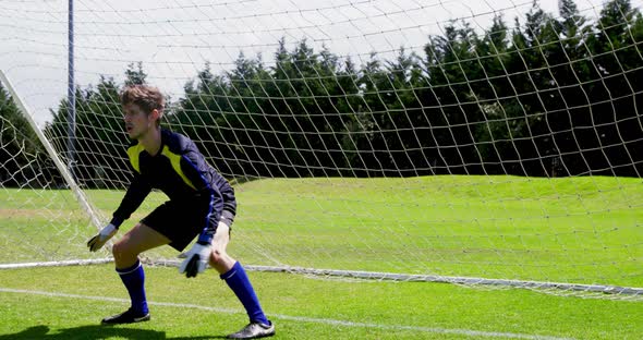 Goalkeeper defending a goal in the field