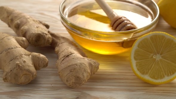 Ginger Tea with Lemon, Mint and Honey on Wooden Background.