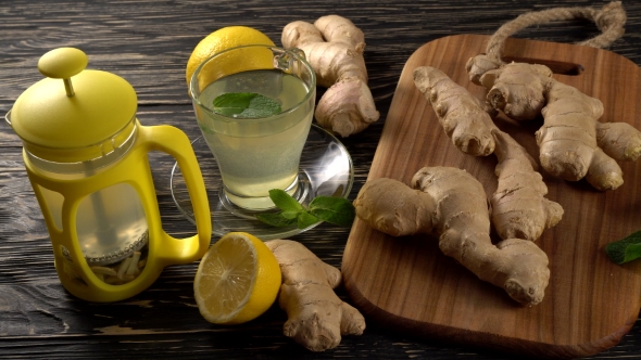 Ginger Tea with Lemon, Mint and Honey on Wooden Background.