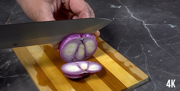 Man Cuts Red Onions